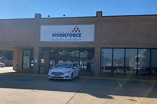 People wait in line to file for unemployment at the Little Rock office of the state Division of Workforce Services in this May 22, 2020 file photo. (Arkansas Democrat-Gazette/Stephen Swofford)